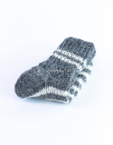 High, thick, white socks with wool filling with a gray, highlander pattern