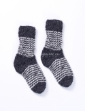 High, thick, white socks with wool filling with a gray, highlander pattern
