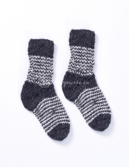 High, thick, white socks with wool filling with a gray, highlander pattern