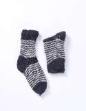 High, thick, white socks with wool filling with a gray, highlander pattern