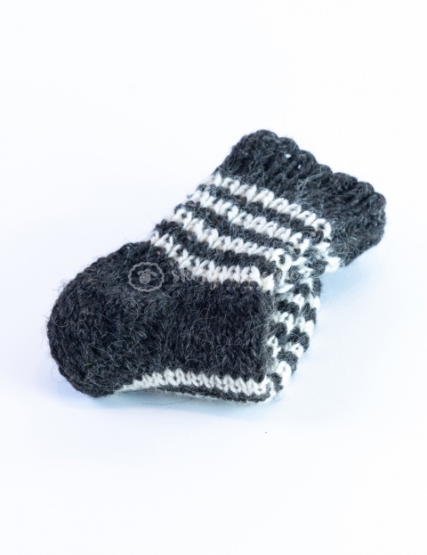 High, thick, white socks with wool filling with a gray, highlander pattern