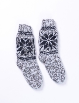 High, thick, white socks with wool filling with a gray, highlander pattern